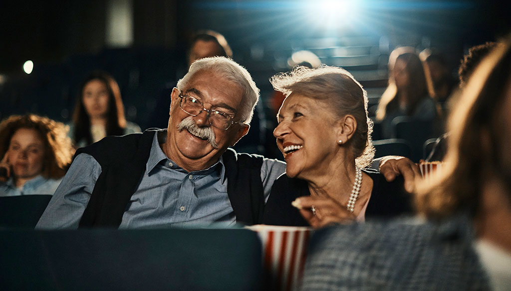 Couple wearing hearing aids at the theater